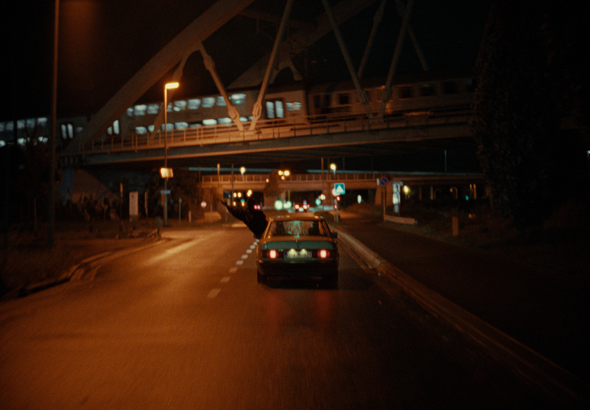 A car driving through Antwerp at night